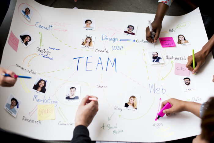 Group of people brainstorming meeting in the room